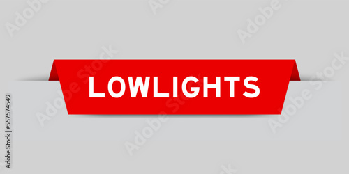 Red color inserted label with word lowlights on gray background