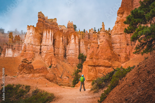 hiker on queens's garden trail in bryce canyon