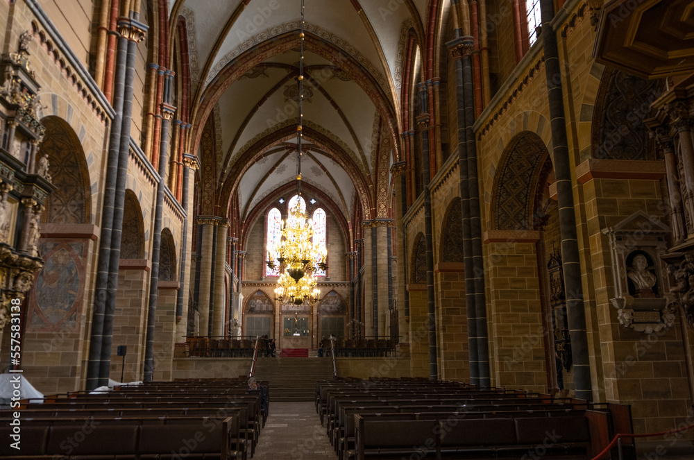 The Old City of Bremen, Market Place, Old Buildings, St. Petri Dom, Roland Statue, old statues of Bremen, Germany  from inside man standing in the church