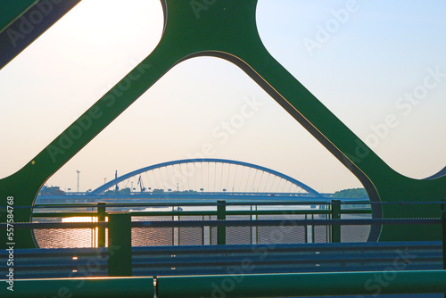 The view of Apollo bridge through arches of Old Bridge over the Danube River in Bratislava, Slovakia