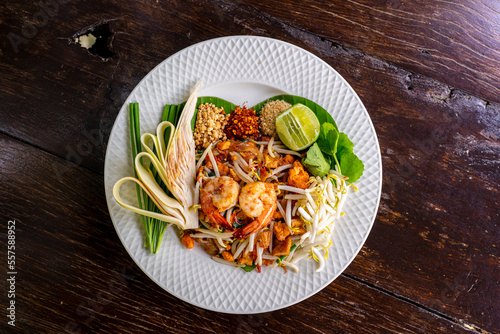 A delicious and colorful plate of pad thai, a popular Thai noodle dish, captured from above. This pad thai stock photo would be perfect for any food-related project, such as a restaurant menu.