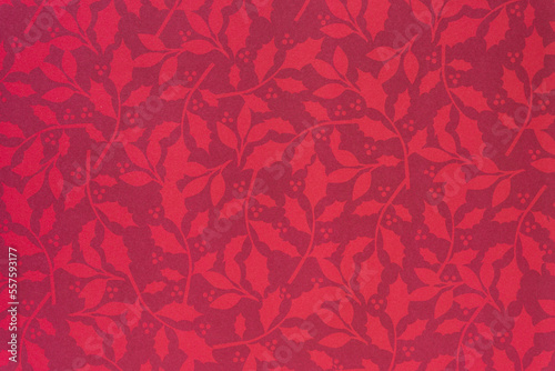 holiday themed scrapbook paper background: holly leaves and berry sprigs