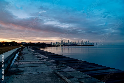 Fototapeta Naklejka Na Ścianę i Meble -  Downtown Chicago and Lake Michigan During the Blue Hour as viewed from just off of Lake Shore Drive near the 49th Street Beach