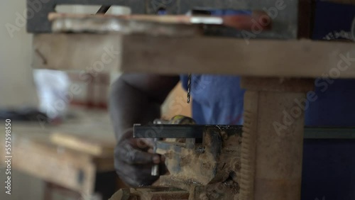 Man working in shop with his hands