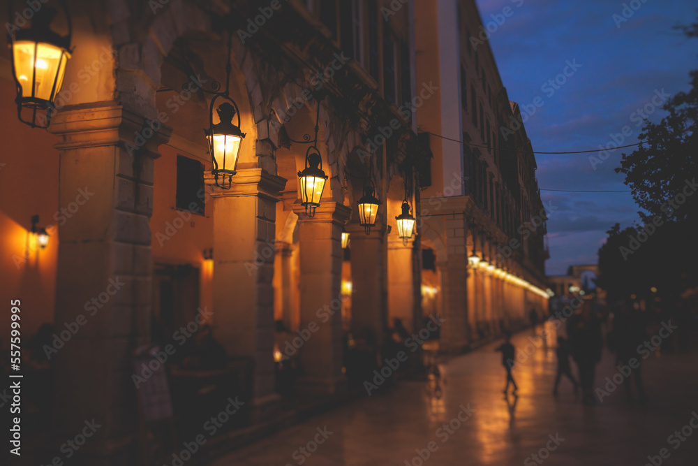 Liston pedestrian street night view with evening lanterns illumination, Kerkyra city, Corfu island, Greece, Ionian sea islands, old town center