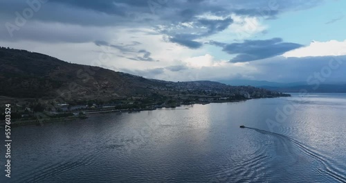 boat in lake near city coast at winter