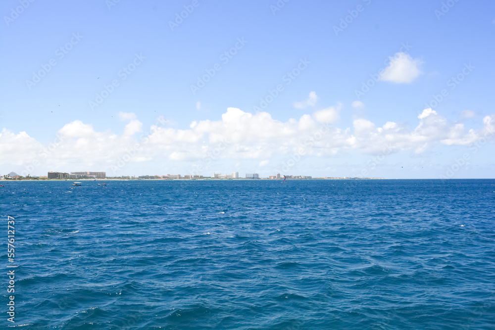 Obraz premium A view on Aruba coast from offshore Caribbean sea. Space for copy. 