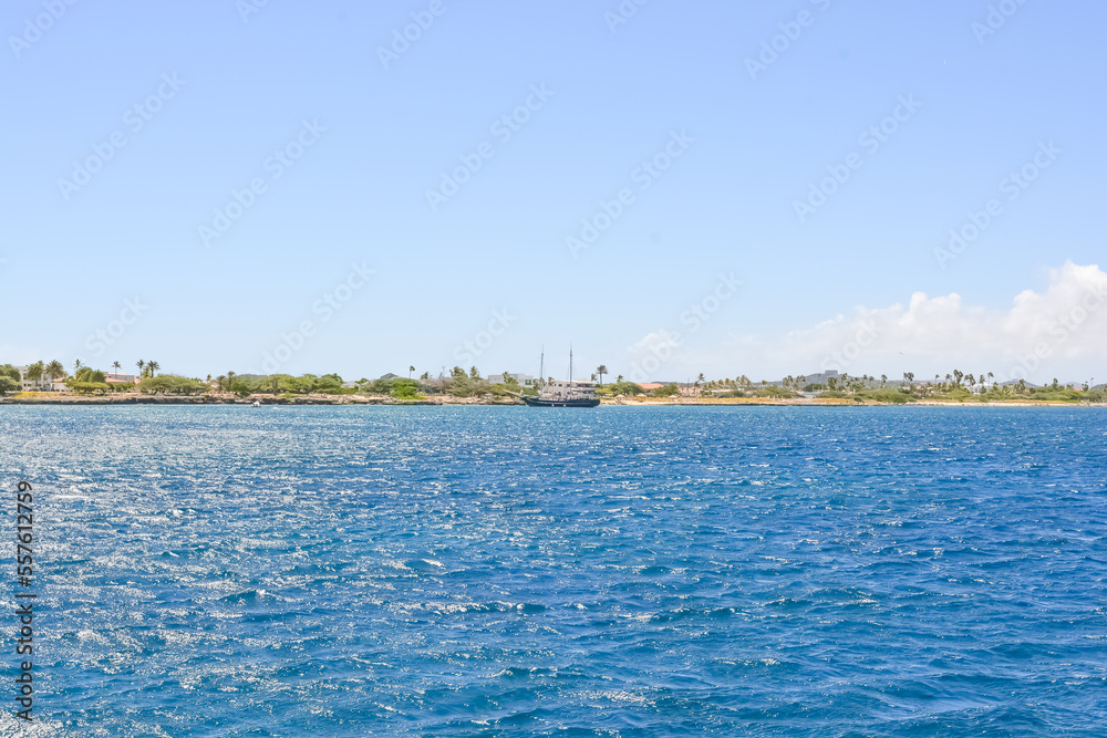 Fototapeta premium A view on Aruba coast from offshore Caribbean sea. Space for copy. 
