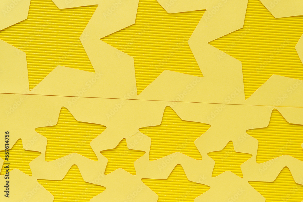 yellow paper stencil with stars on yellow corrugated paper texture yellow paper stencil with stars on yellow corrugated paper texture