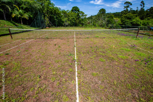 Old abandoned grass tennis court on farm. Countryside of Brazil