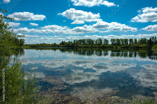 Cloudy Sky Reflections on a Mirrored Florida Lake
