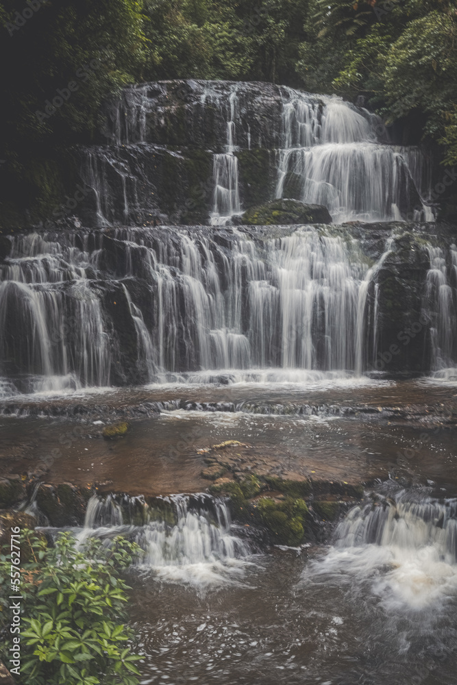 Wide waterfall among trees