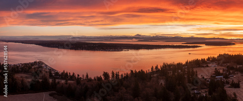 Aerial Winter Sunrise Over Hale Passage and Lummi Island. Snow blankets this lovely small island located minutes from Bellingham  Washington and accessed by a twenty one car ferry boat. 