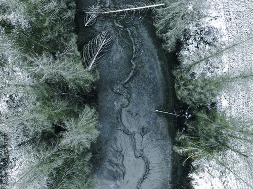Drained pond in winter from top