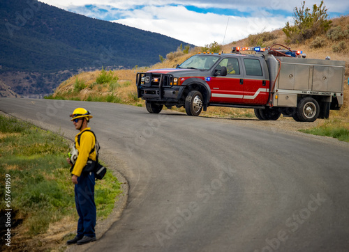 Firefighter working to battle a brush fire