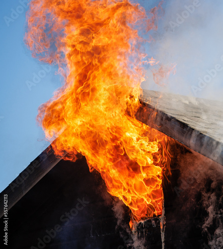 Firefighters battle a house fire