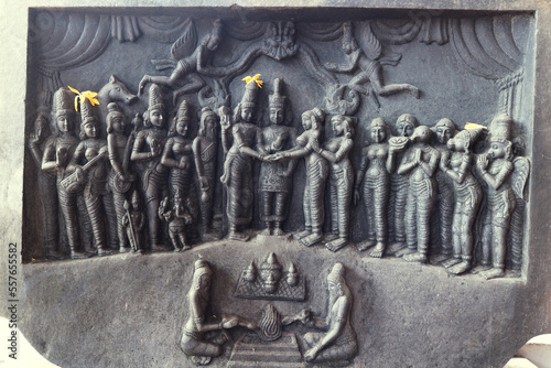 The wedding of Balaji and Padmavati is carved on a stone outside a Hindu temple in Tirumala, Tirupati, India. photo