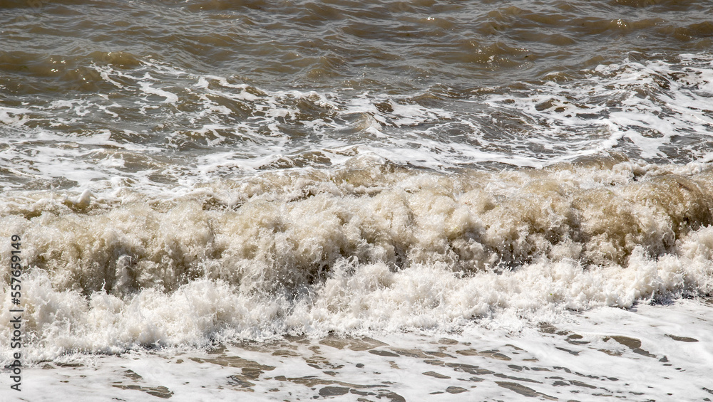 foamy coastal sea wave of a pebble beach foamy coastal sea wave of a pebble beach