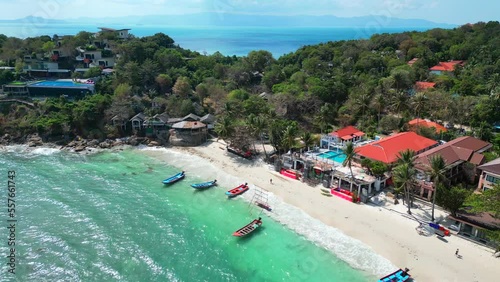 Aerial view of a amazing beach and longtail boats in Thailand. photo