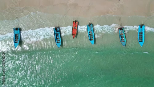 Aerial view of a amazing beach and longtail boats in Thailand. photo