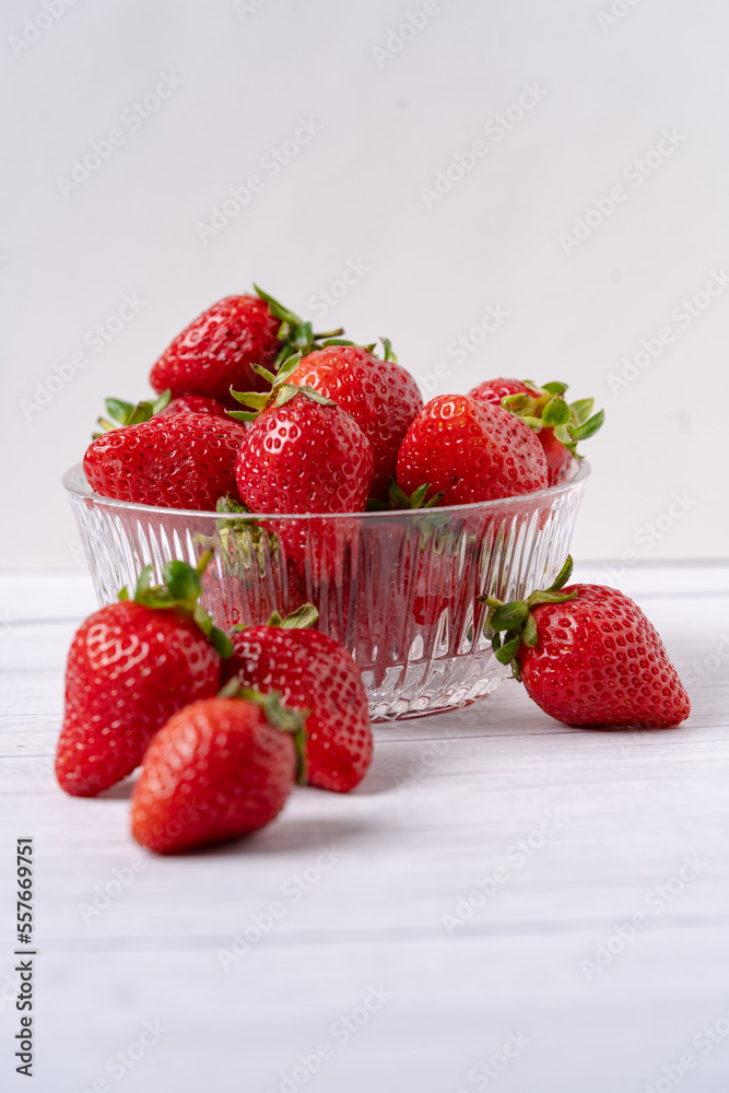 Fresh Organic Strawberries on a white wooden surface Fresh Organic Strawberries on a white wooden surface