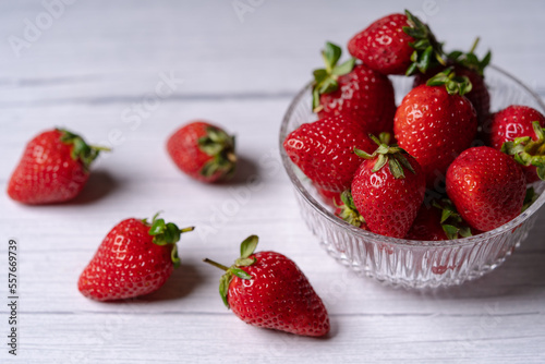 Fresh Organic Strawberries on a white wooden surface
