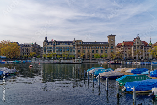 Fototapeta Naklejka Na Ścianę i Meble -  Famous wooden women bath at Limmat River with building in the background at City of Zürich on a blue cloudy autumn day. Photo taken October 30th, 2022, Zurich, Switzerland.