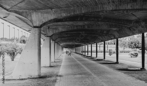 Black and white photo of under passage of bridge in Spain