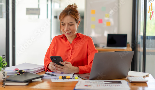 Photo of successful concentrated boss use modern gadget macbook email chat write notes weekly plan report office room indoor workstation