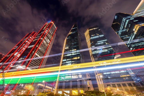 Night time lapse of a busy road in Yeouido transit center and famous skyscrapers in the background in Seoul City South Korea.