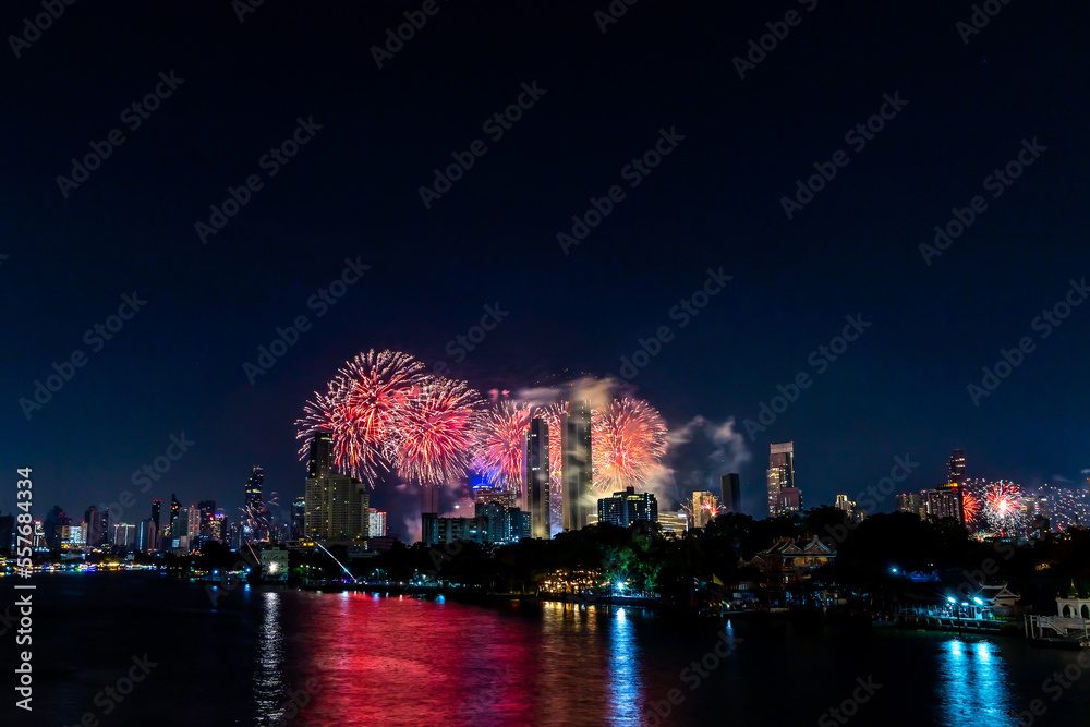 Amazing Thailand Countdown 2023 celebration with multicolor  firework display on Chaophraya River at Icon Siam, Bangkok city, Thailand
