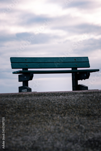 Bench on the horizon in clouds