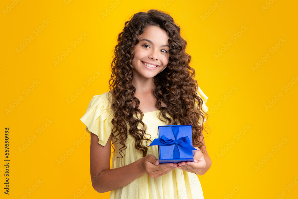 Happy teenager portrait. Cute teenager child girl congratulate with valentines day, giving romantic gift box. Present, greeting and gifting birthday concept. Smiling girl. Happy teenager portrait. Cute teenager child girl congratulate with valentines day, giving romantic gift box. Present, greeting and gifting birthday concept. Smiling girl.