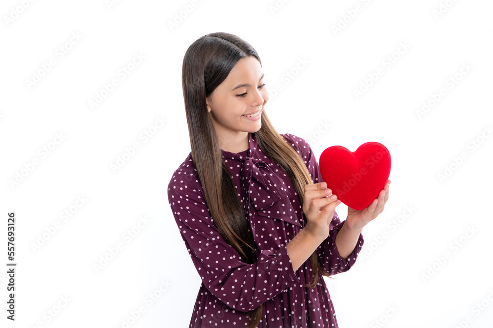 Teenage girl hold shape heart, heart-shape sign. Child holding a red heart love holiday valentine symbol, isolated on white background. Portrait of happy smiling teenage child girl. Teenage girl hold shape heart, heart-shape sign. Child holding a red heart love holiday valentine symbol, isolated on white background. Portrait of happy smiling teenage child girl.