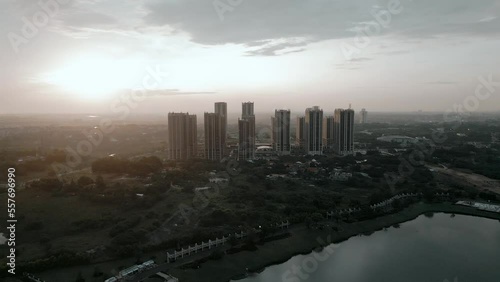 Bekasi, Indonesia - December 24, 2022: apartment area in Cikarang, Bekasi with lake around with sunset view photo