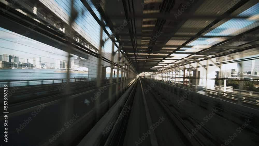 (Part 5 of 6) Point of view Yurikamome line automated train moving forward crossing Rainbow bridge to Odaiba in Tokyo, Japan. Advanced transportation system, Asia tourism, transport technology concept (Part 5 of 6) Point of view Yurikamome line automated train moving forward crossing Rainbow bridge to Odaiba in Tokyo, Japan. Advanced transportation system, Asia tourism, transport technology concept