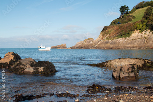 Boat In The Cove/An image of a boat in a cove on the North Devon coastline.