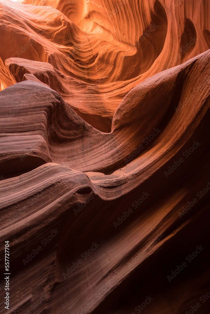 Vertical photo of curved sand walls of Antelope Canyon in Arizona, USA