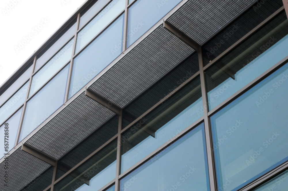 building exterior with glass walls and galvanized steel walkway
building exterior with glass walls and galvanized steel walkway