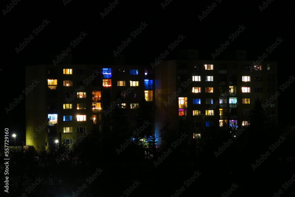 tower building in black dark night with very colorful illumination and lights in kremnica in slovakia