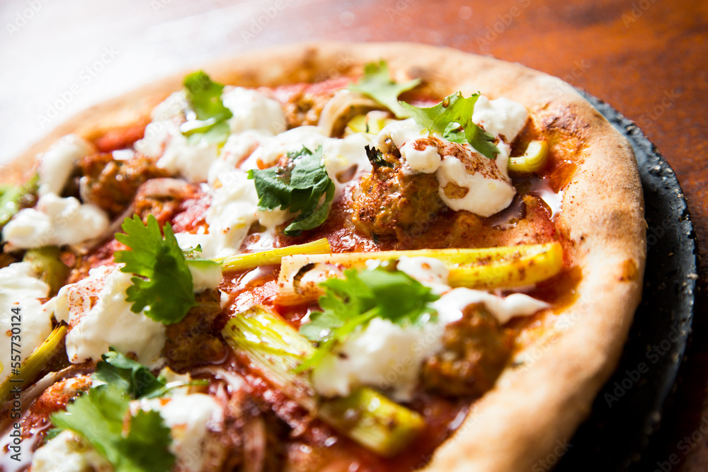 Pizza with meat and curry. Neapolitan pizza made with curry-spiced beef. Italian recipe.