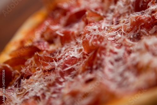 Serrano ham pizza. Neapolitan pizza made with baked vegetables and serrano ham. Italian recipe.