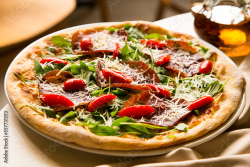 Serrano ham pizza. Neapolitan pizza made with baked vegetables and serrano ham. Italian recipe.