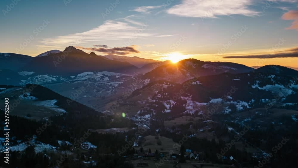 Golden sunset over rural nature with fast clouds sky Aerial view Hyper lapse