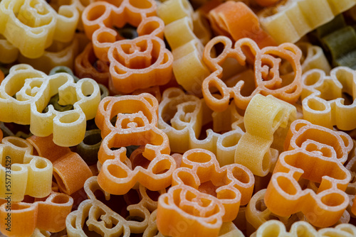 Closeup of Teddy Bear shapes colorful pasta background