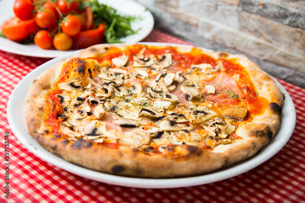 Mushroom Pizza. Neapolitan pizza with tomato sauce, cheese, ham and mushrooms. Authentic Italian recipe.