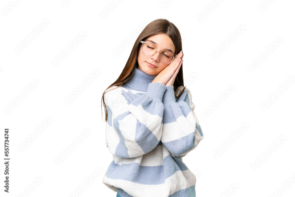 Teenager girl over isolated chroma key background making sleep gesture in dorable expression Teenager girl over isolated chroma key background making sleep gesture in dorable expression