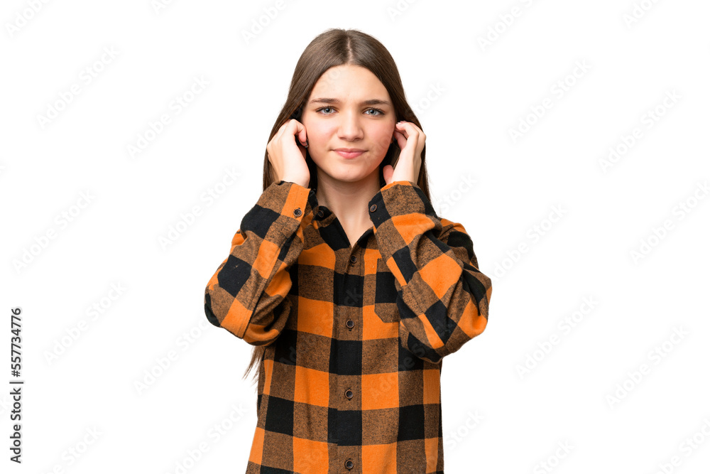 Teenager girl over isolated chroma key background frustrated and covering ears Teenager girl over isolated chroma key background frustrated and covering ears