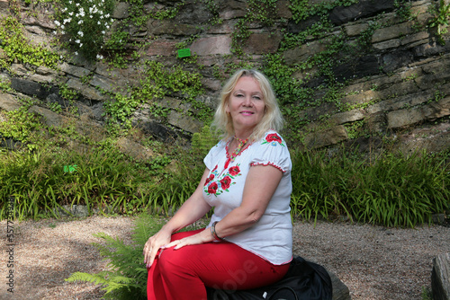 person sitting on a stone
