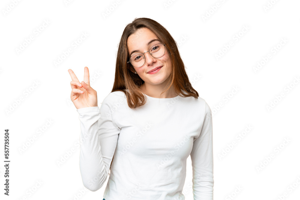 Teenager girl over isolated chroma key background smiling and showing victory sign Teenager girl over isolated chroma key background smiling and showing victory sign